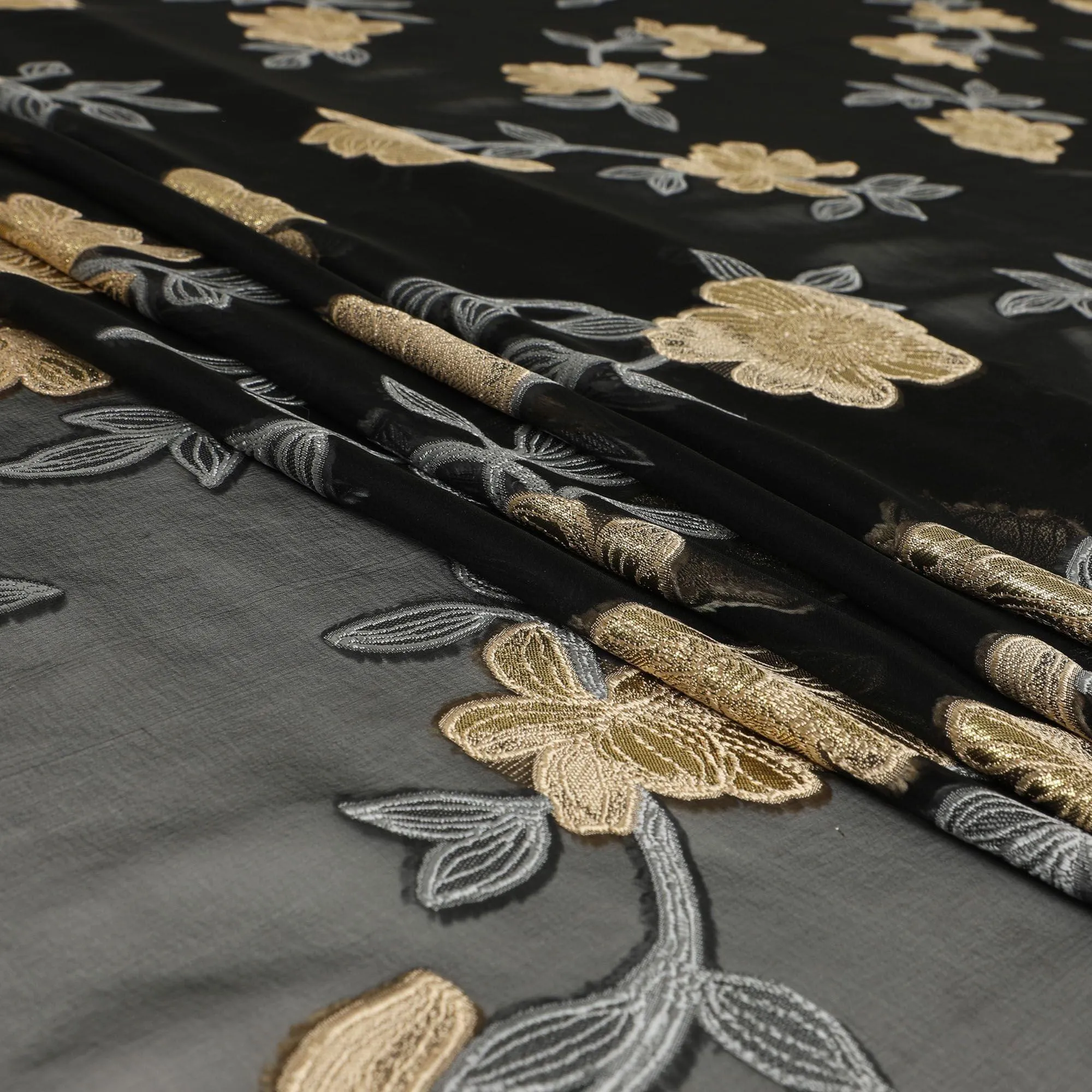 Black French silk chiffon fabric with steel grey, beige viscose and golden metallic lurex in floral design