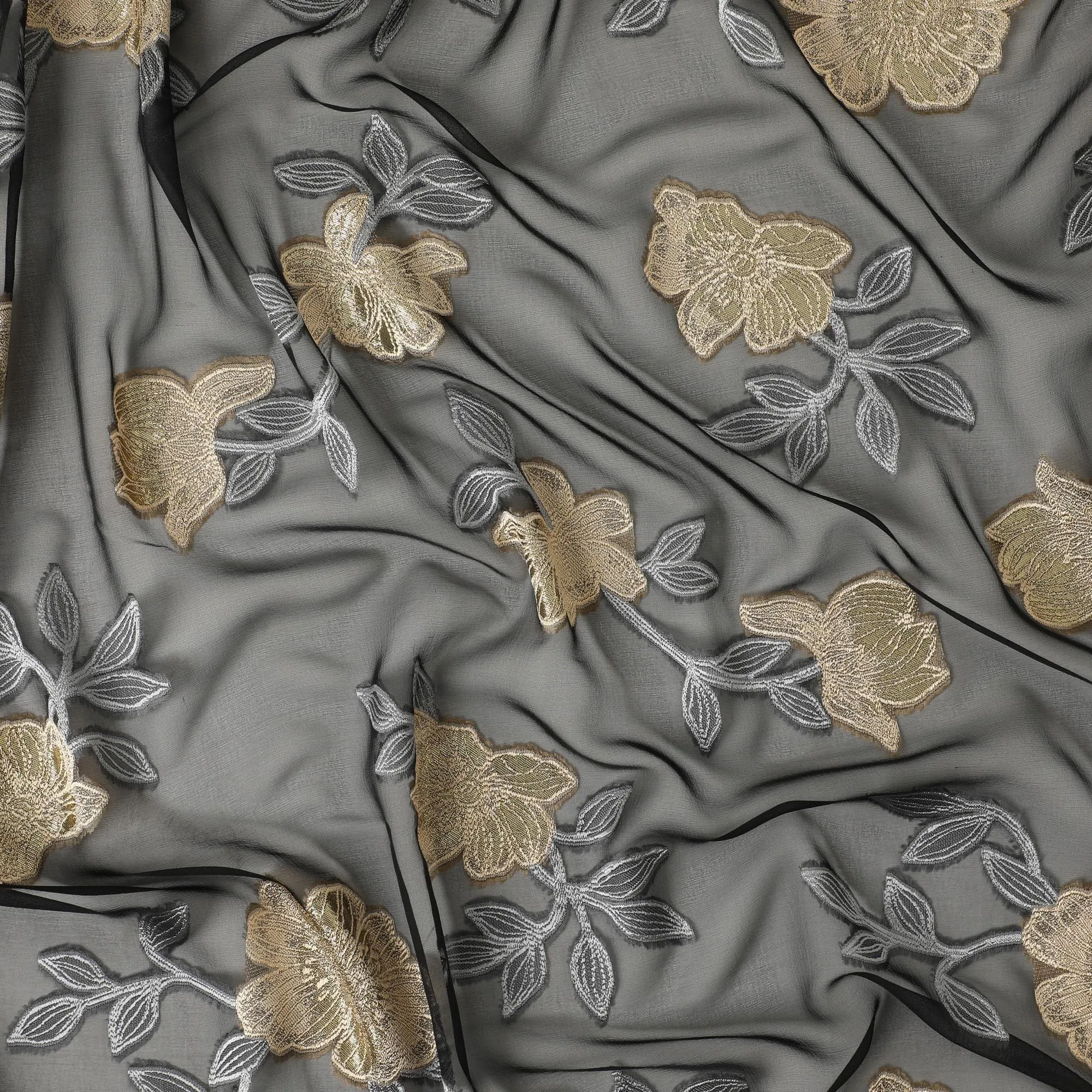 Black French silk chiffon fabric with steel grey, beige viscose and golden metallic lurex in floral design